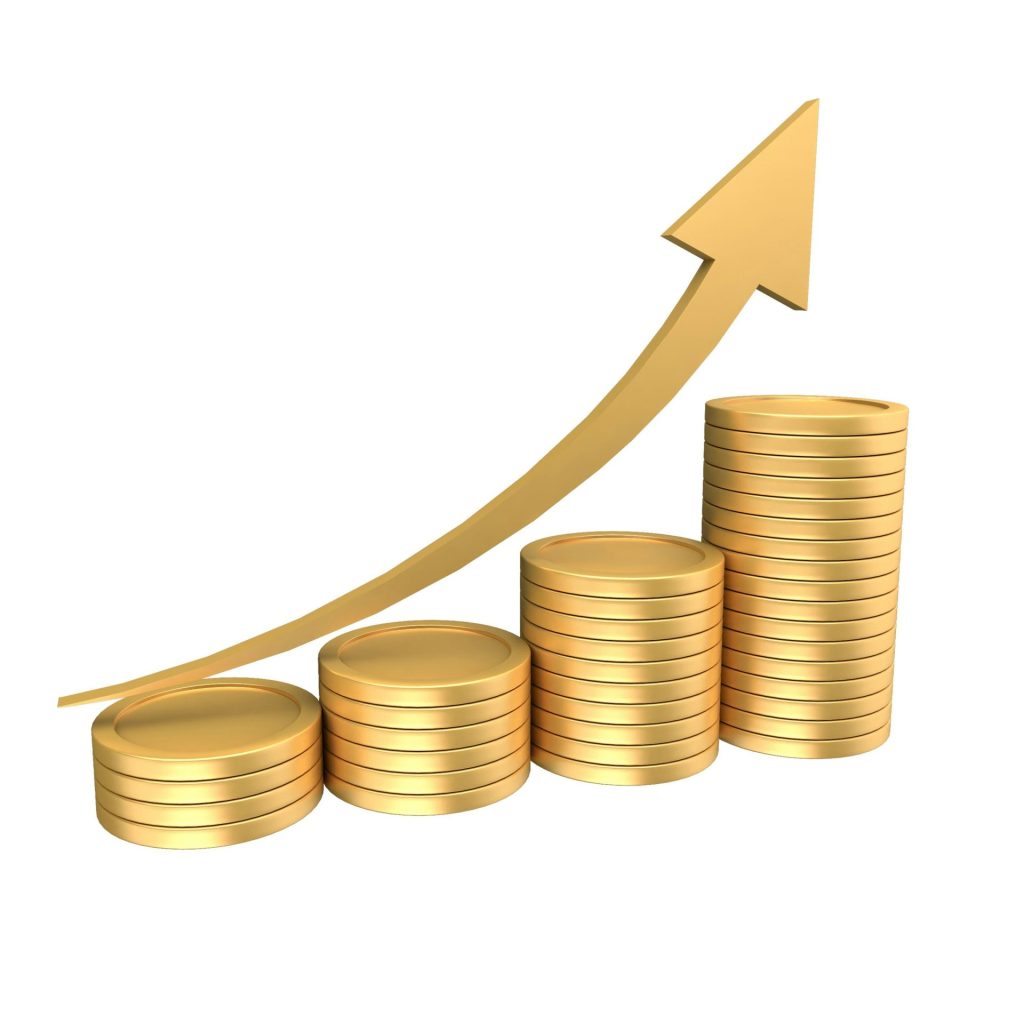 Stacks of gold coins with an upward trending arrow.